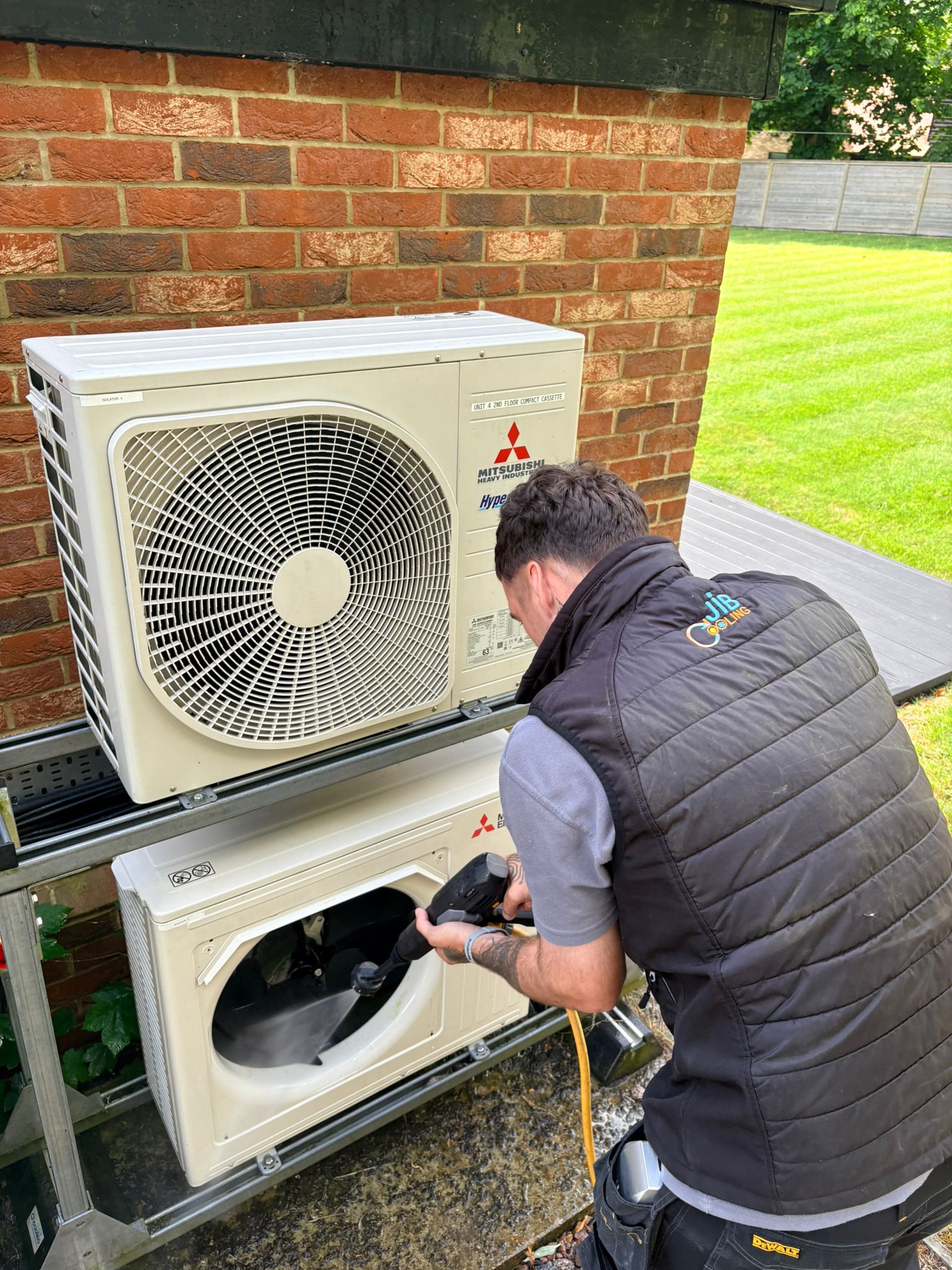 JIB Cooling engineer servicing outdoor air conditioning units in Kent