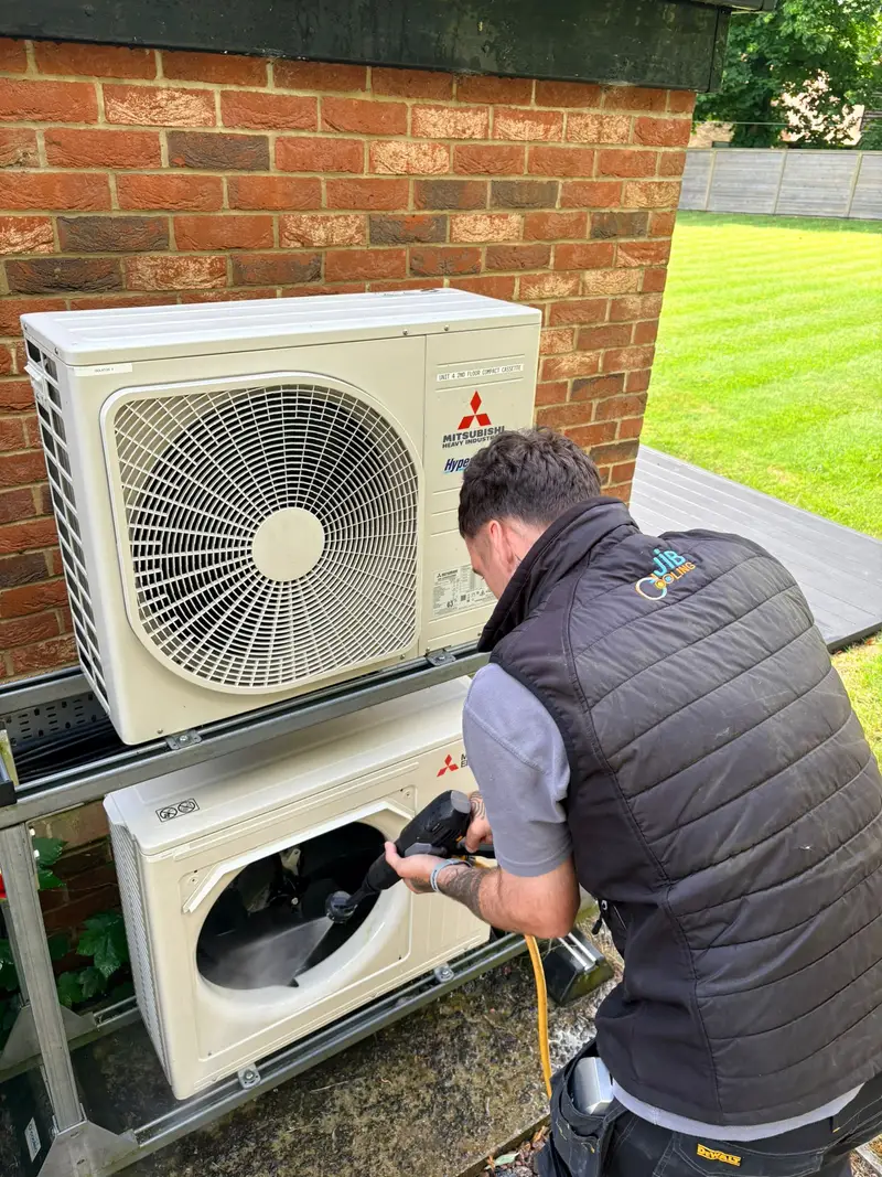 JIB Cooling engineer servicing outdoor air conditioning units in Kent