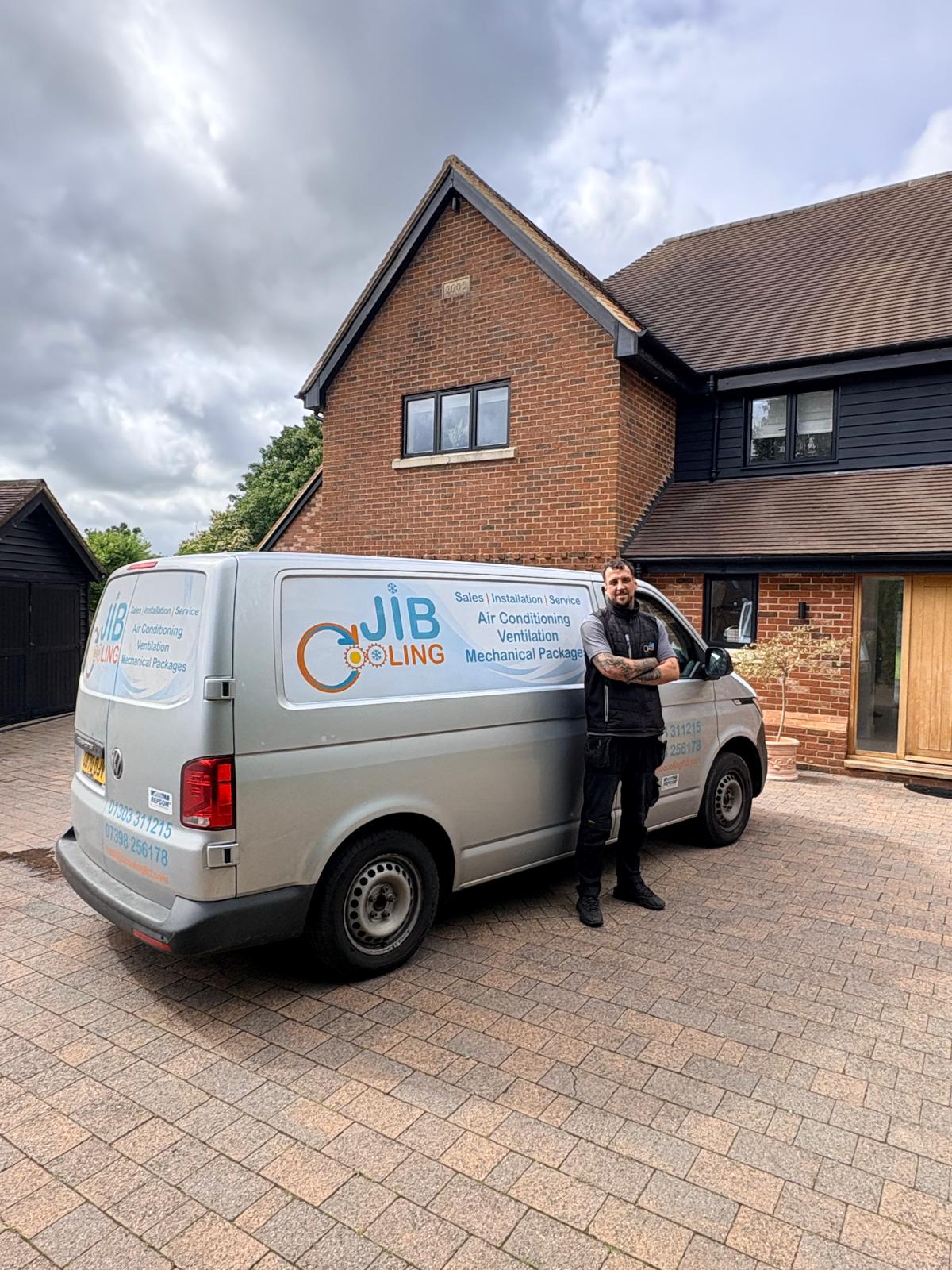 JIB Cooling engineer with the company van outside a Kent home