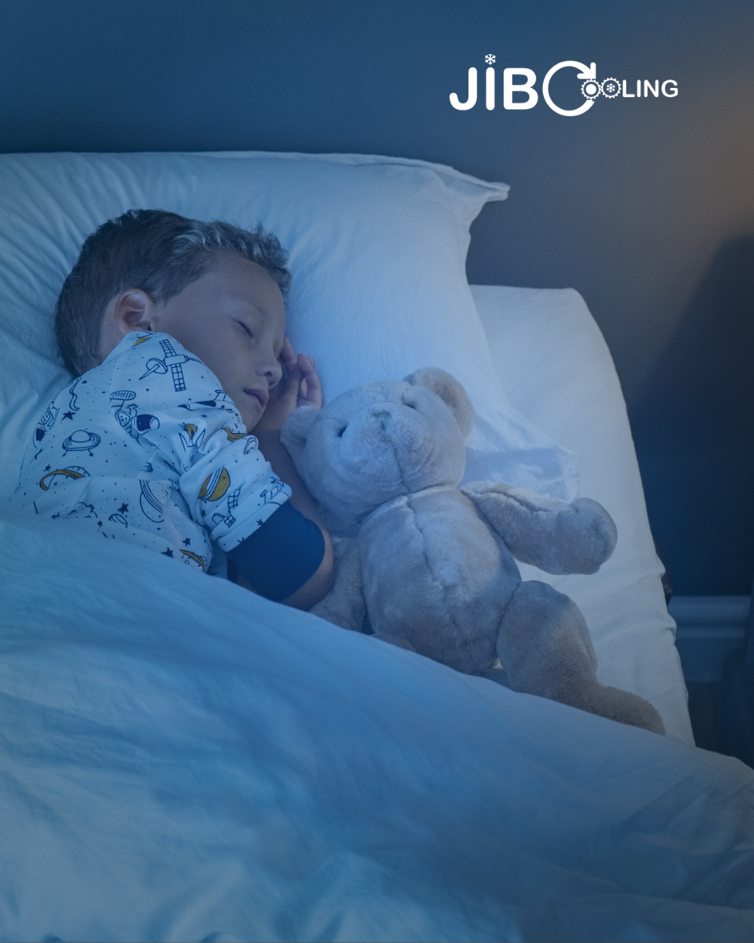 Boy sleeps soundly in a bedroom cooled by air conditioning