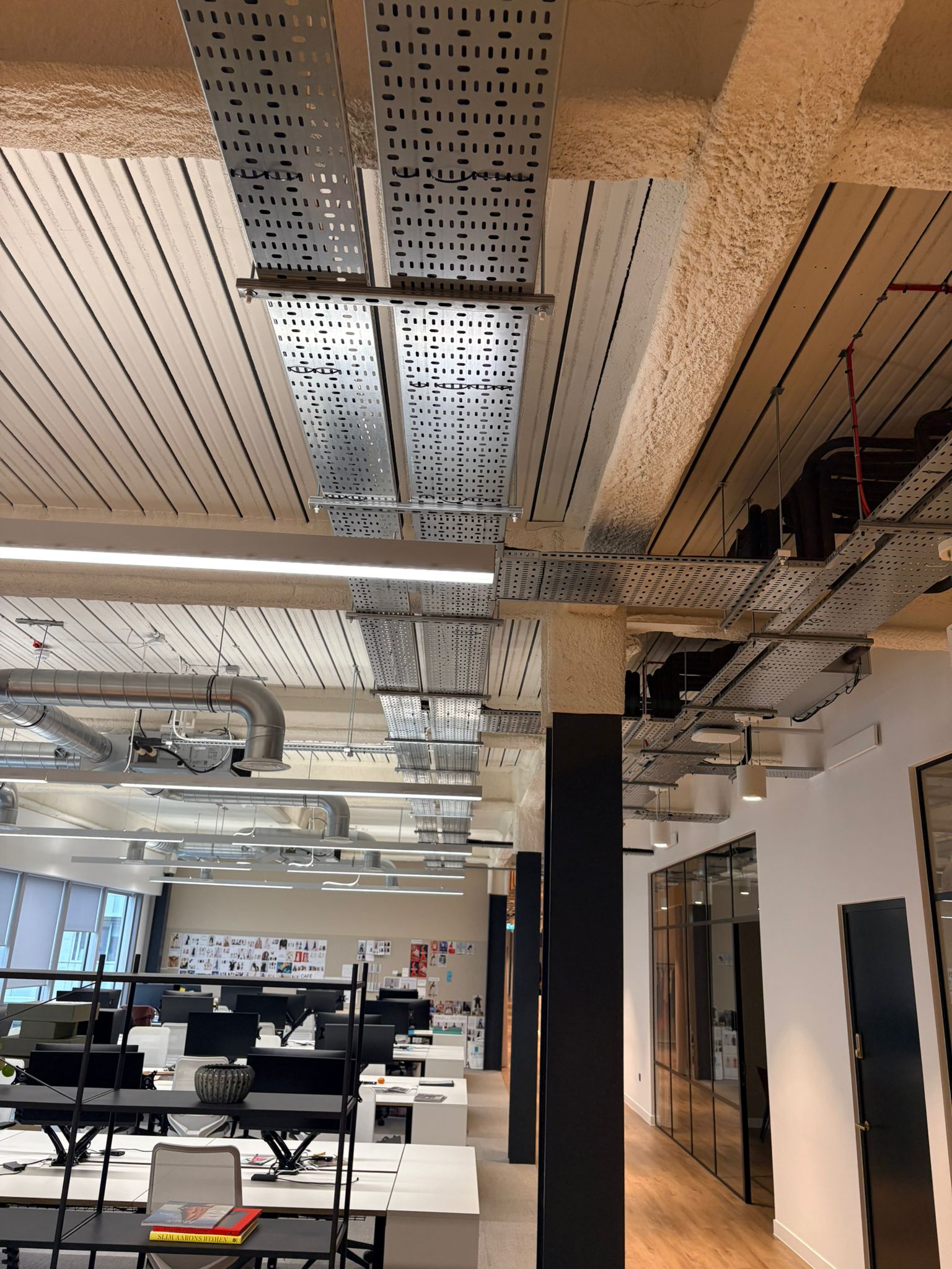 Commercial air conditioning installed in a Canterbury office with exposed air conditioning pipework