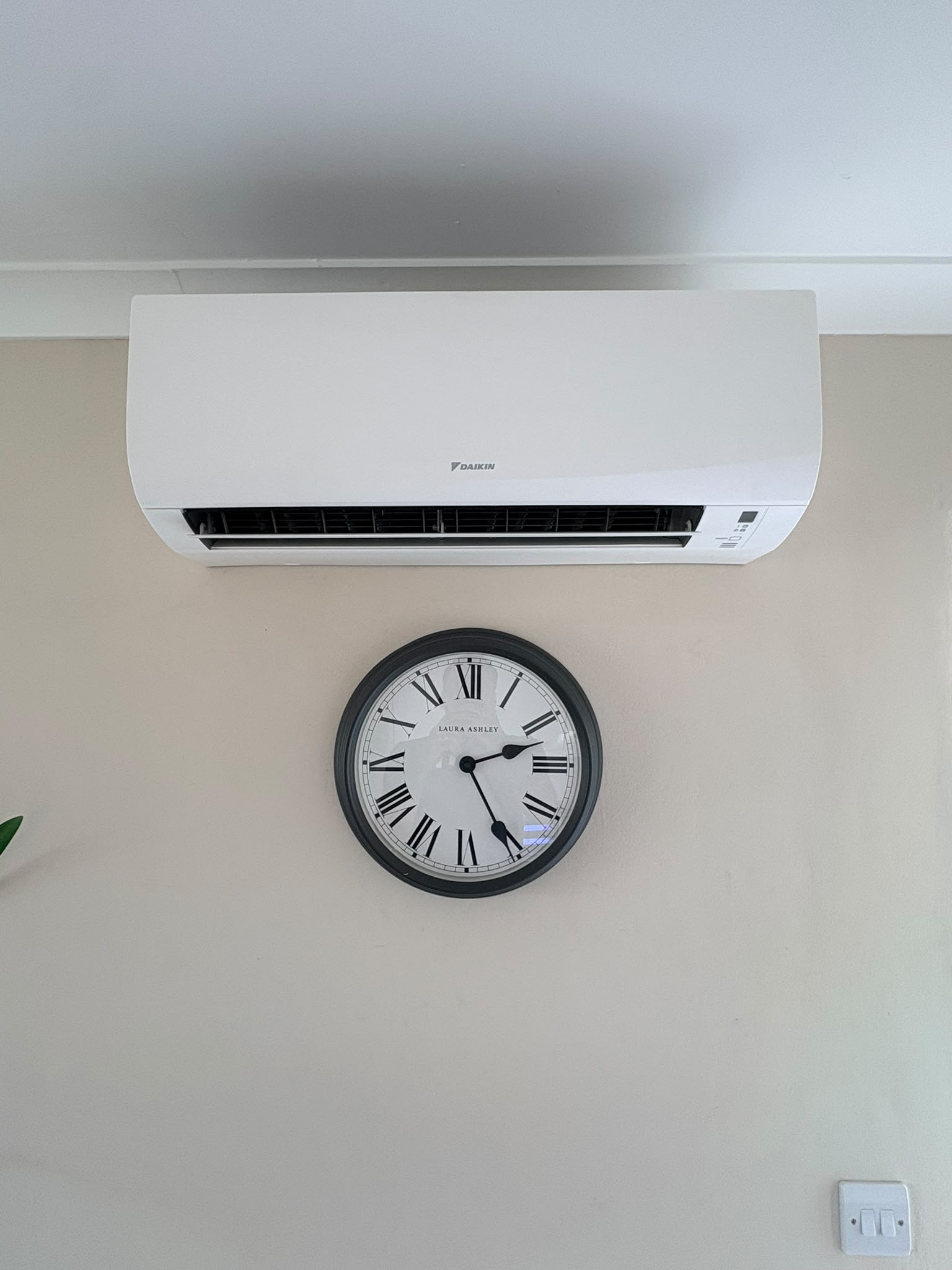 Daikin indoor unit sited high and centred on the wall