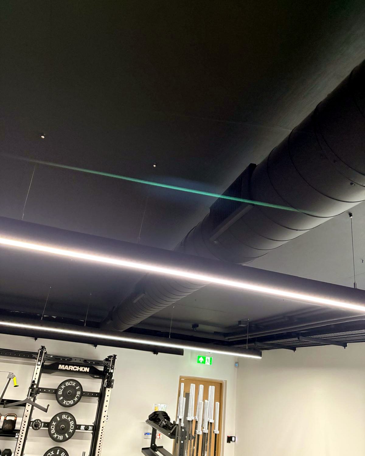 Commercial ductwork installation showing concealed system